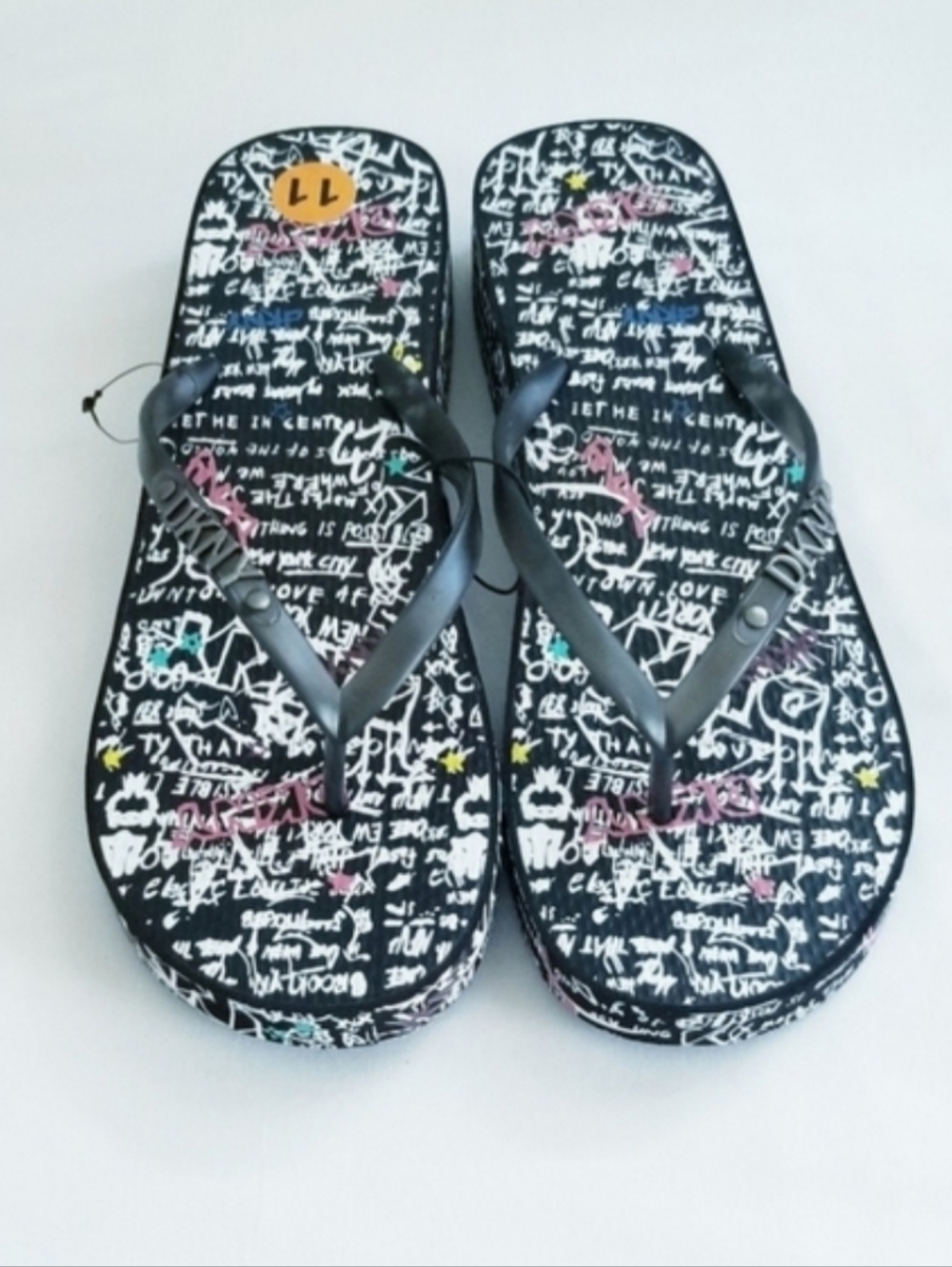 DKNY Jazzi Wedge Thong Flip Flop Slippers Black Graffiti Letters DKNY Logo Charm